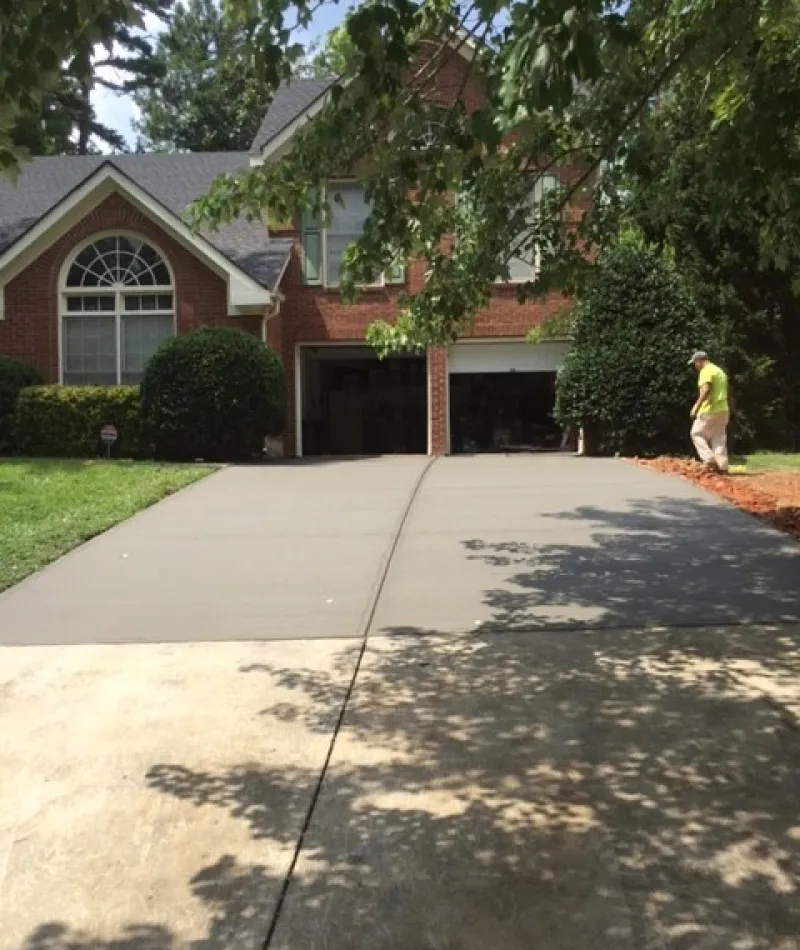 a man standing in front of a house