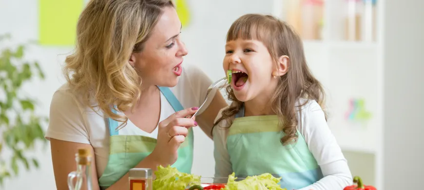 a person and a girl eating food.