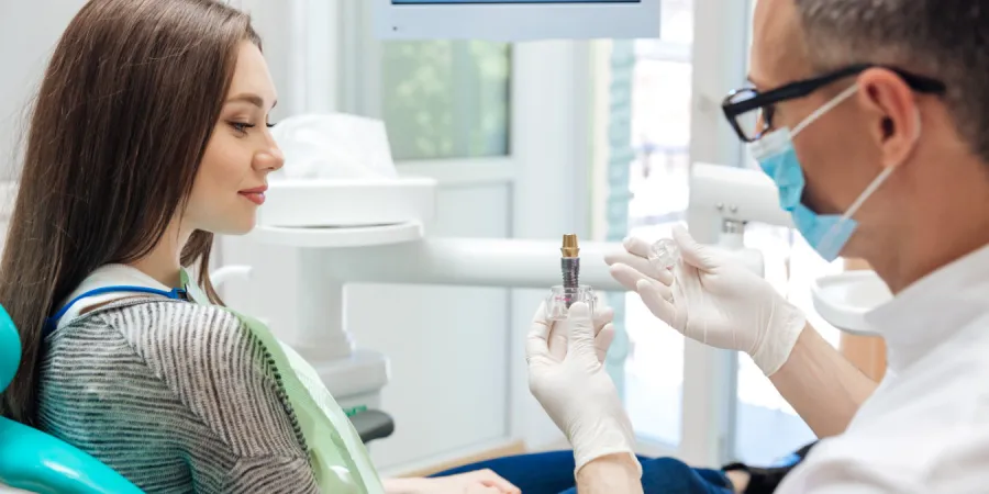 a dentist speaking to a patient