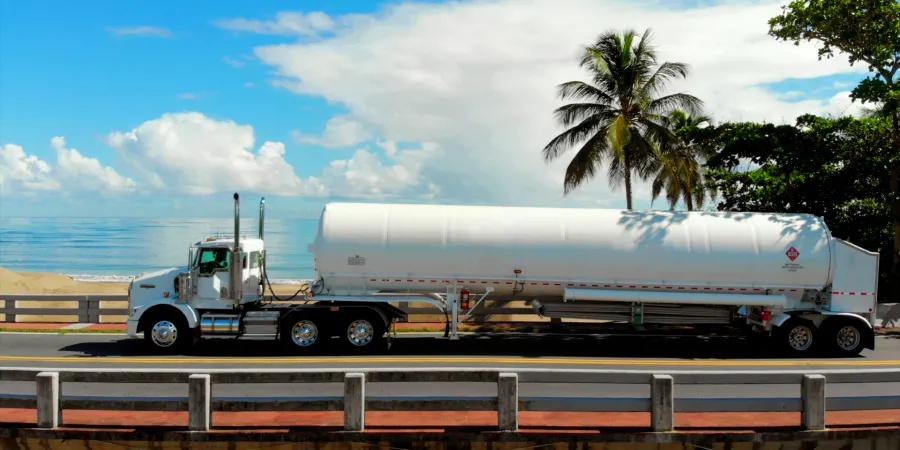 a truck carrying a container tanker