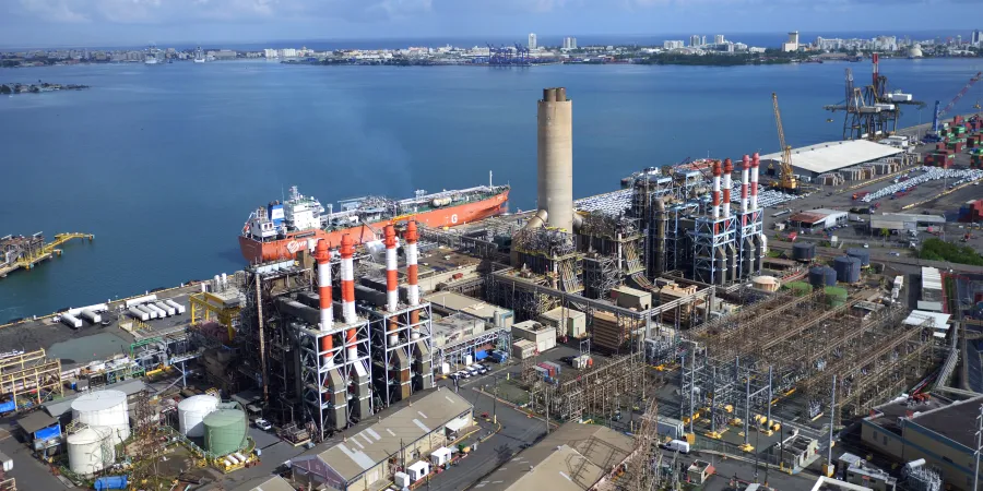 a large factory by the water