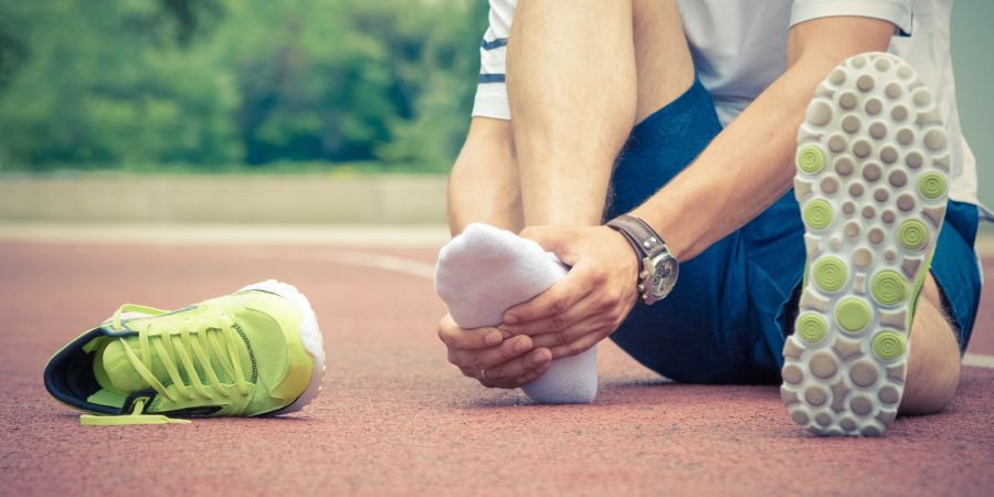 a person holding their foot