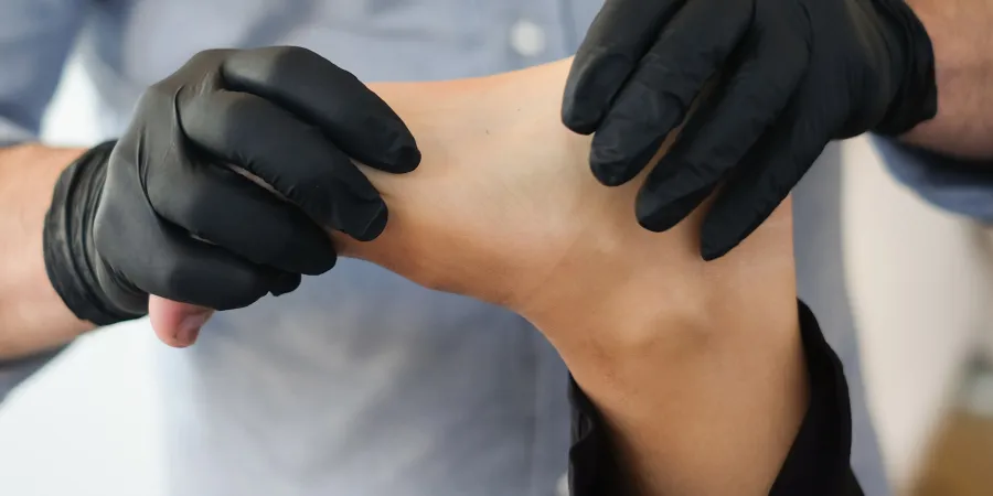a close-up of hands wearing gloves