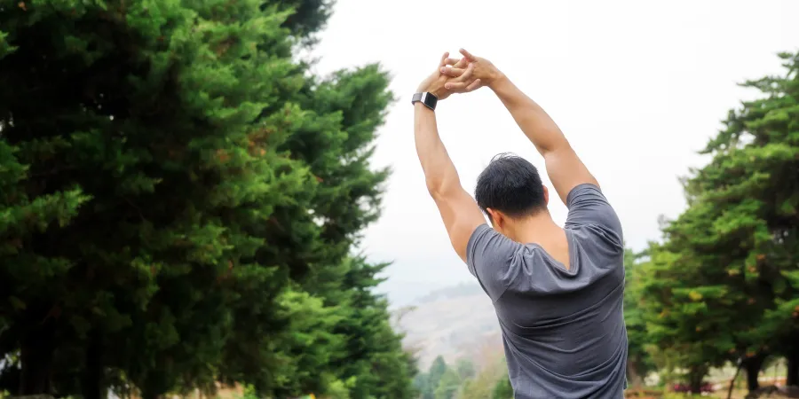 a man with his arms raised