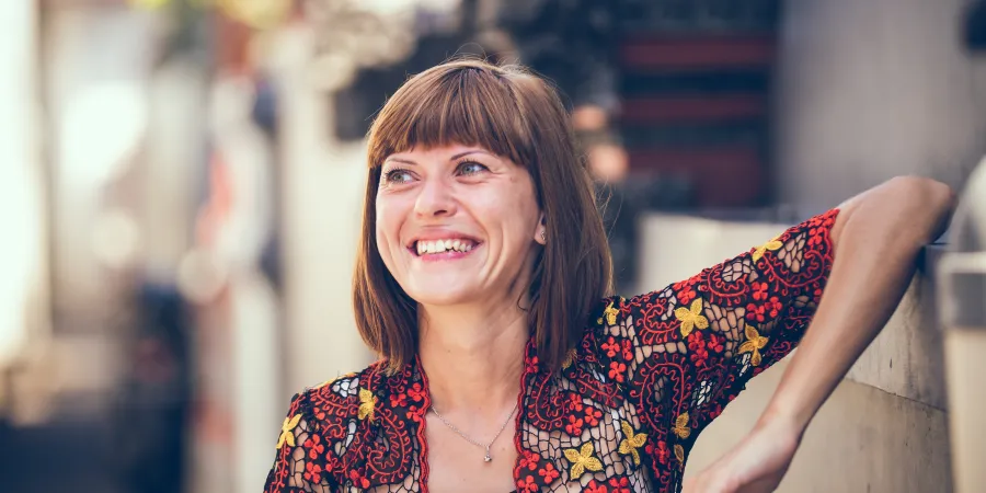 a woman with her arms crossed