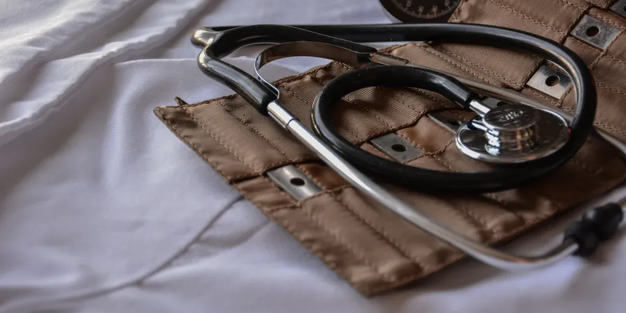 a pair of glasses on a bed