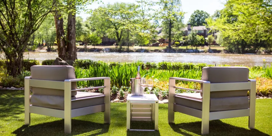 a couple of lawn chairs sitting on top of a picnic table