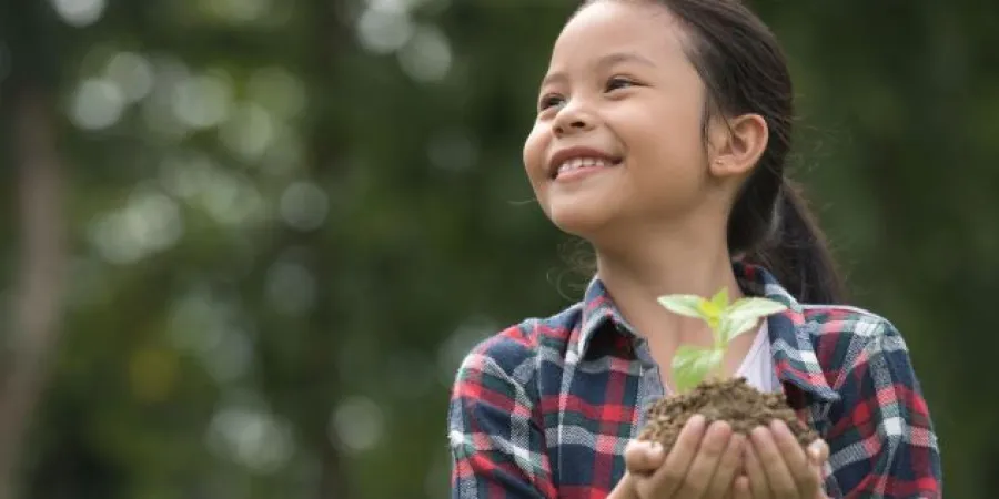 a young girl who is smiling at the camera