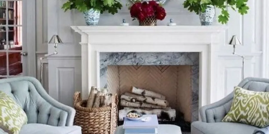 a living room filled with furniture and a fire place
