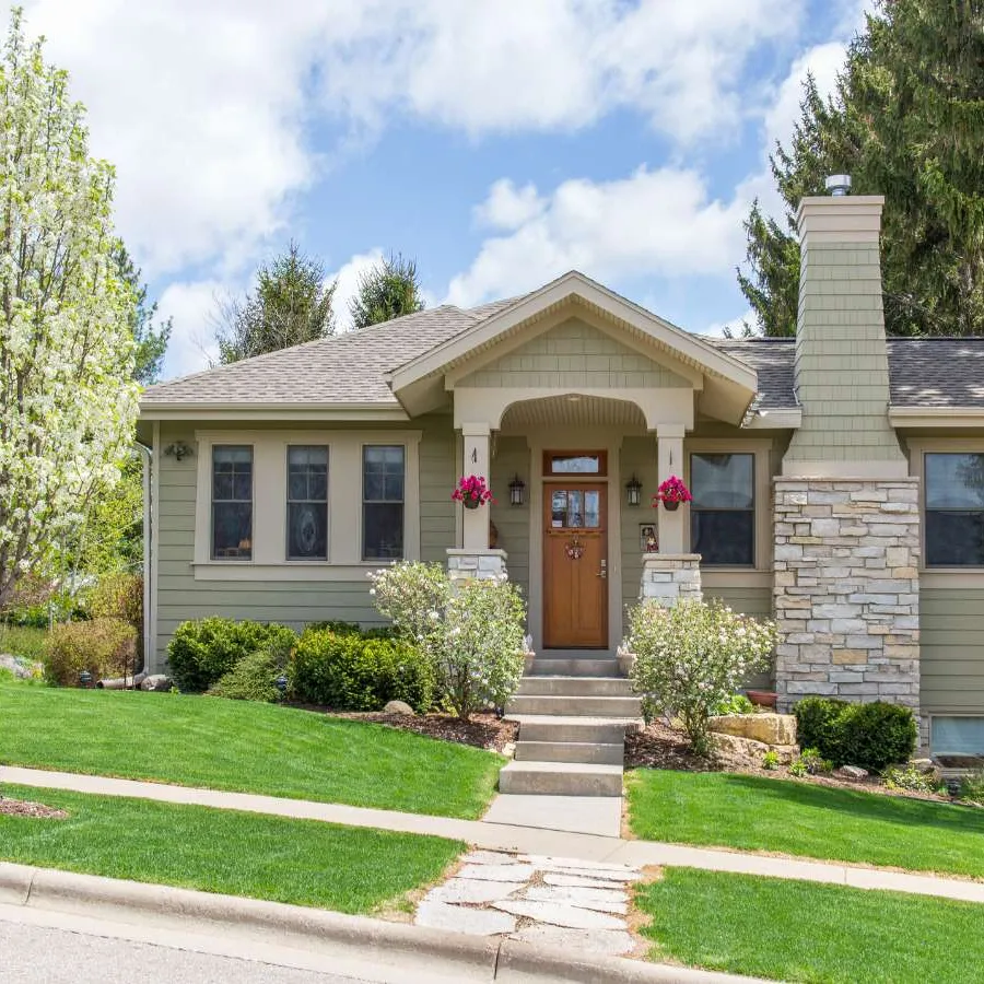 a house with a driveway and a brick driveway