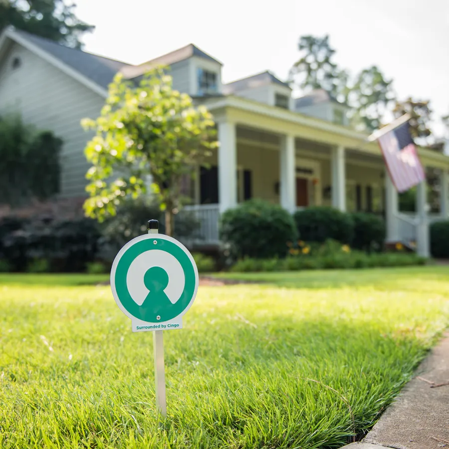 a sign in front of a house