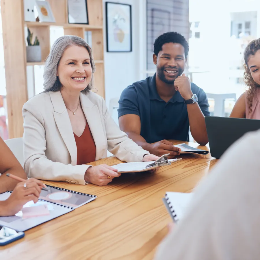 a group of people sitting around a table