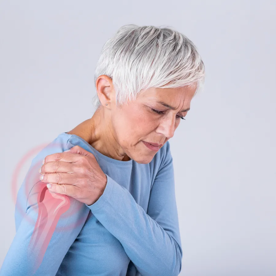 a person holding their shoulder