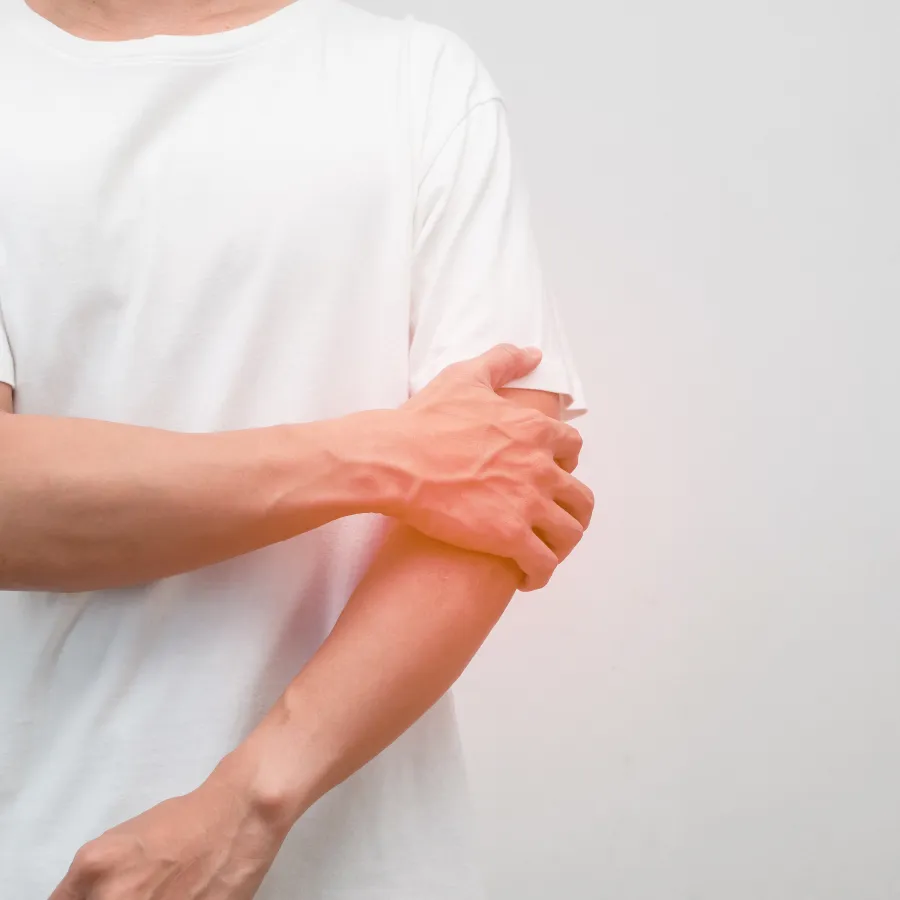 a person holding their elbow