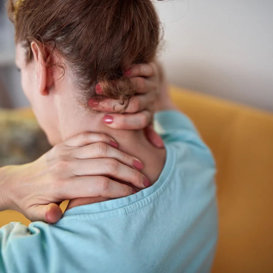 a person with the hands on the neck