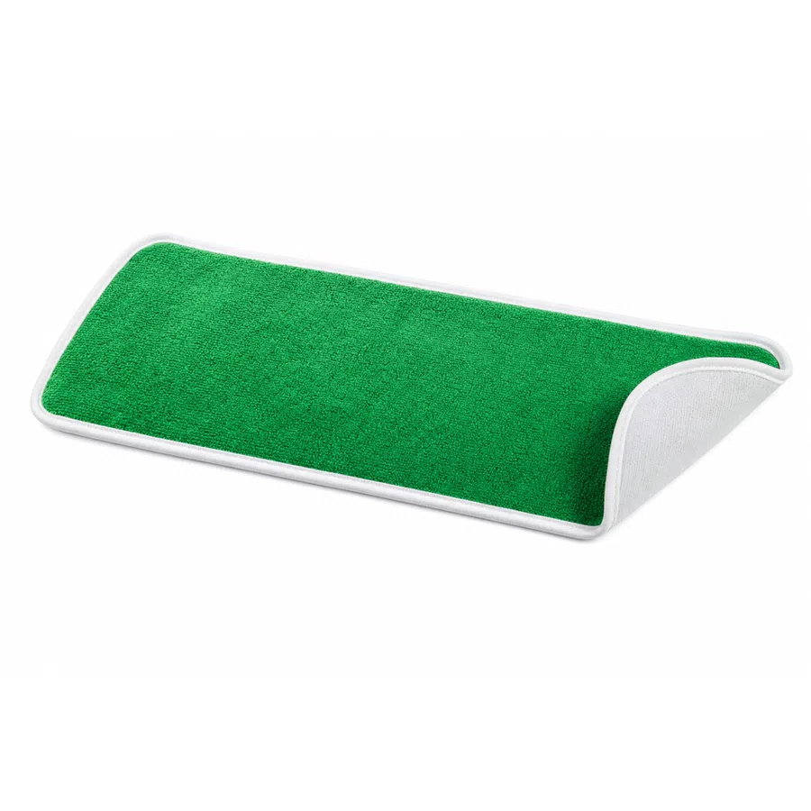 Close-up of a green microfiber mop cloth with white edges, partially folded at one corner