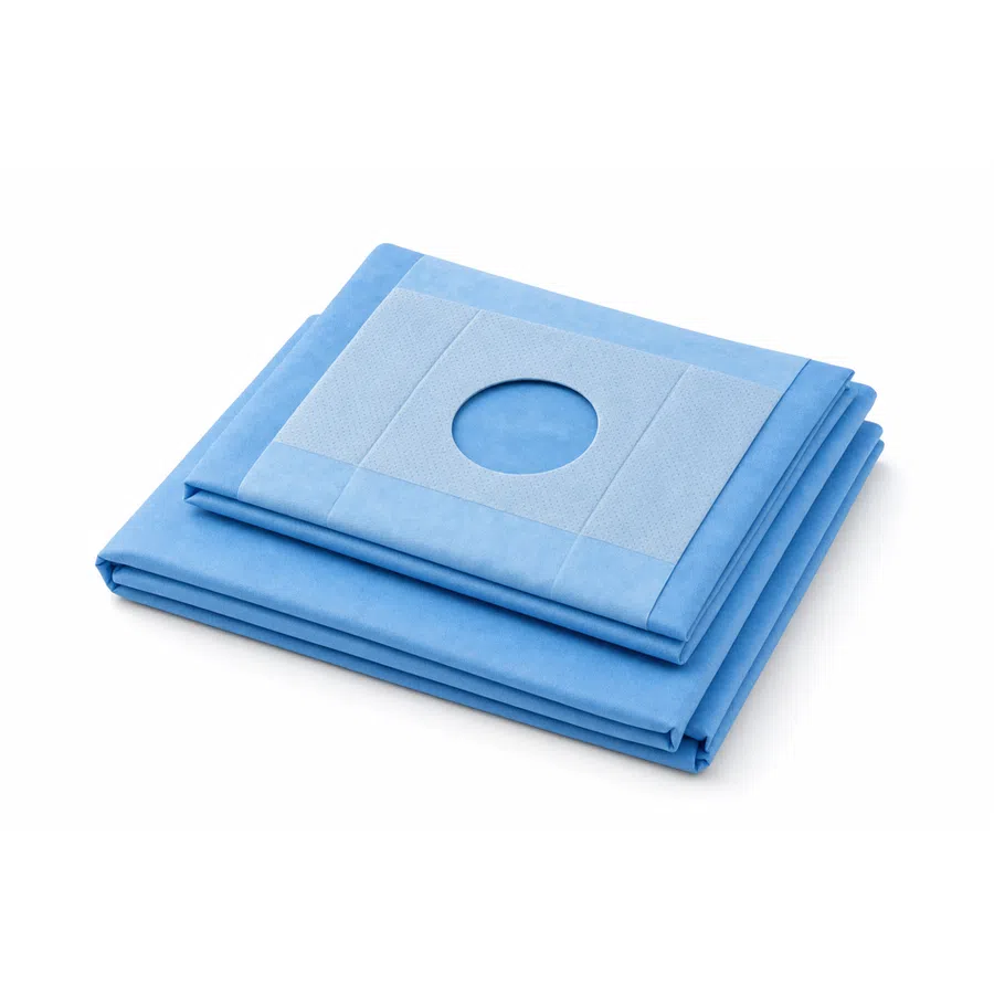 Stack of blue sterile surgical drapes with central circular fenestration on white background
