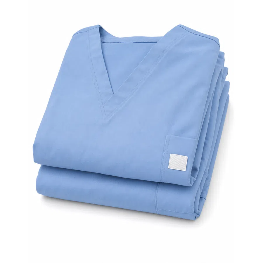 Stack of folded light blue medical scrubs with V-neck design on a white background