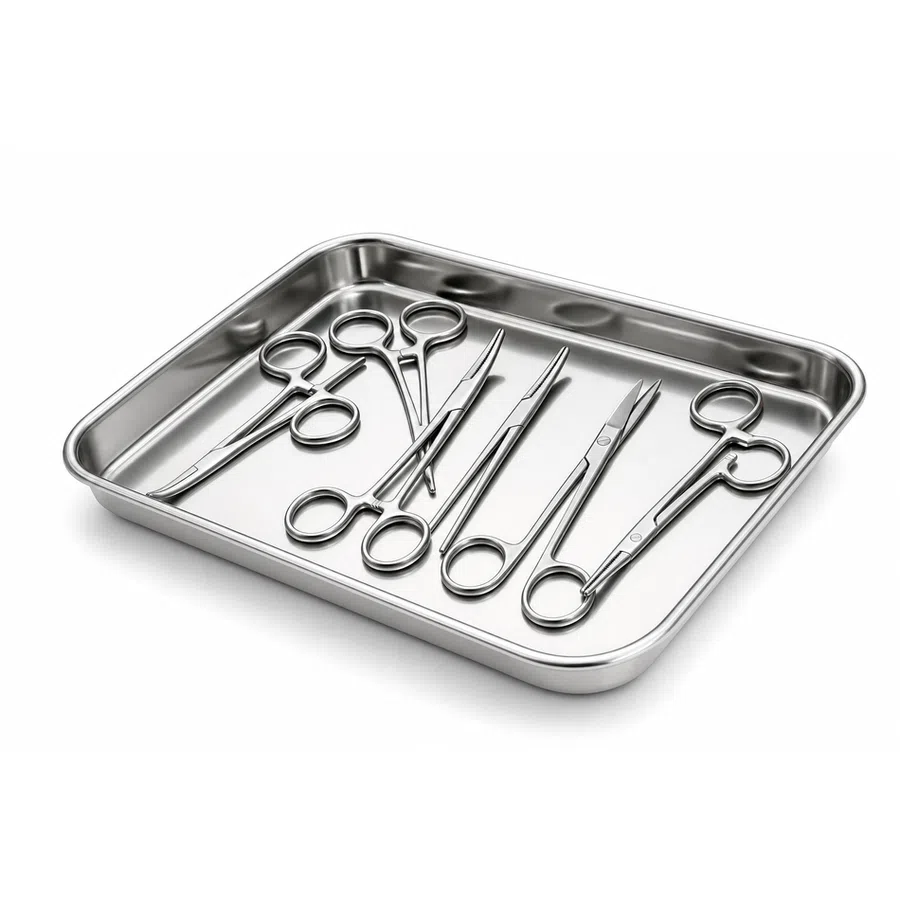 Stainless steel surgical instruments arranged neatly in a rectangular metal tray on white background