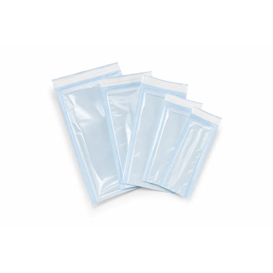 Set of five clear plastic resealable bags in varying sizes arranged on a white surface.