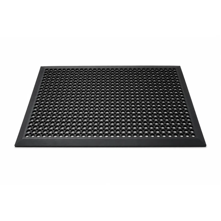 Black rubber anti-fatigue mat with circular holes and beveled edges for safety and comfort.