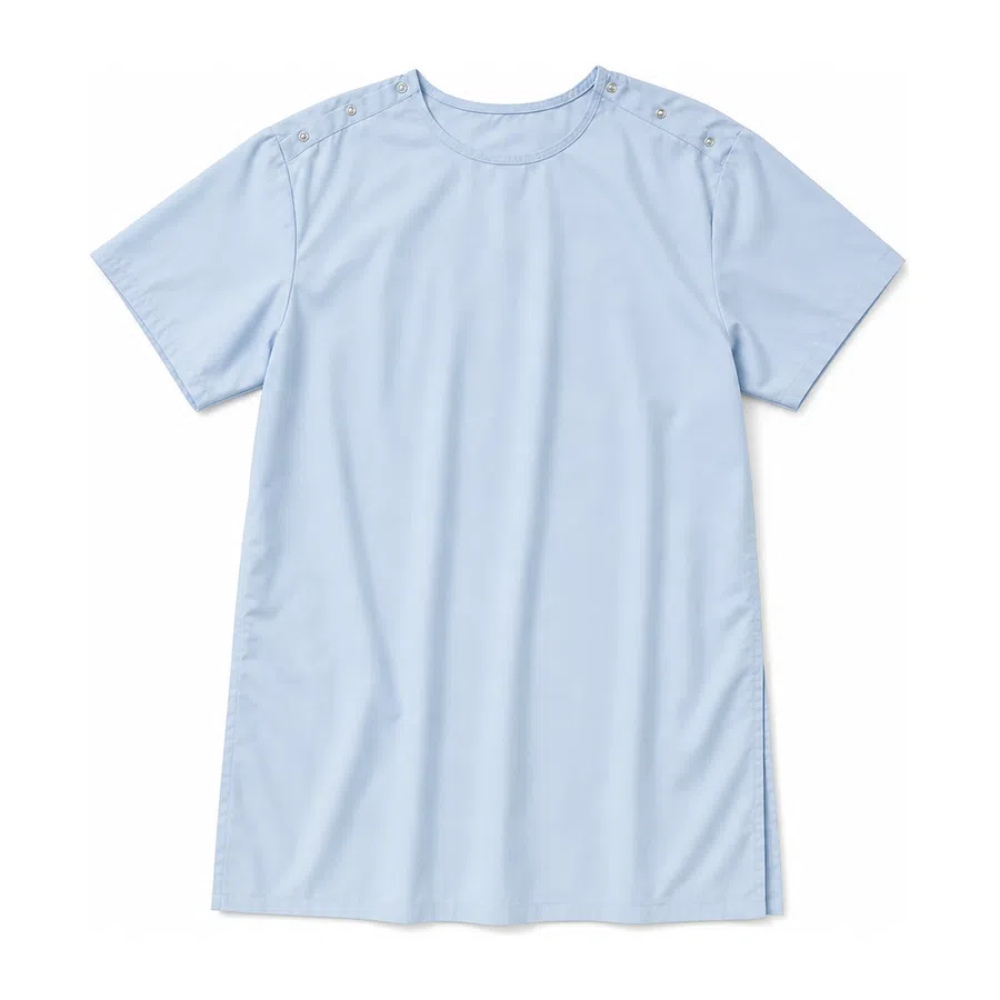Light blue short-sleeve scrub top with button details on shoulder seams laid flat on white background