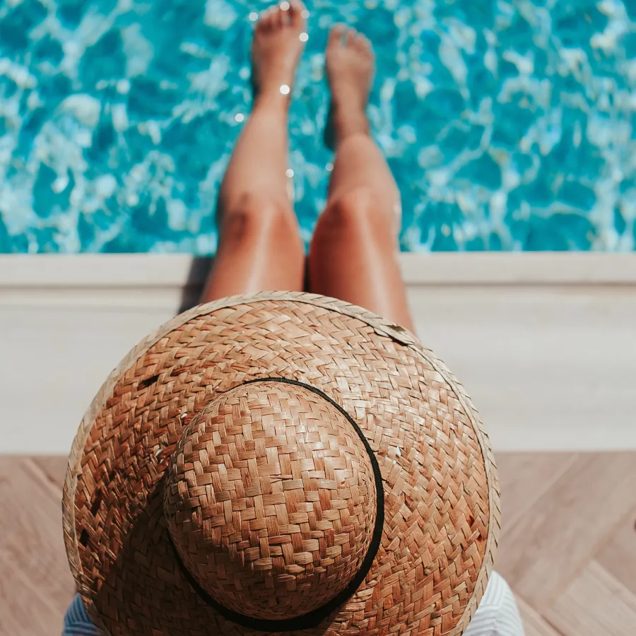 a person's feet in a hat on a rug