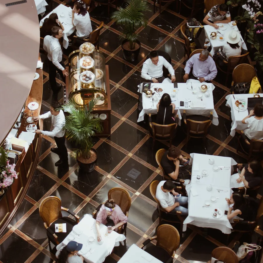 a group of people sitting at tables