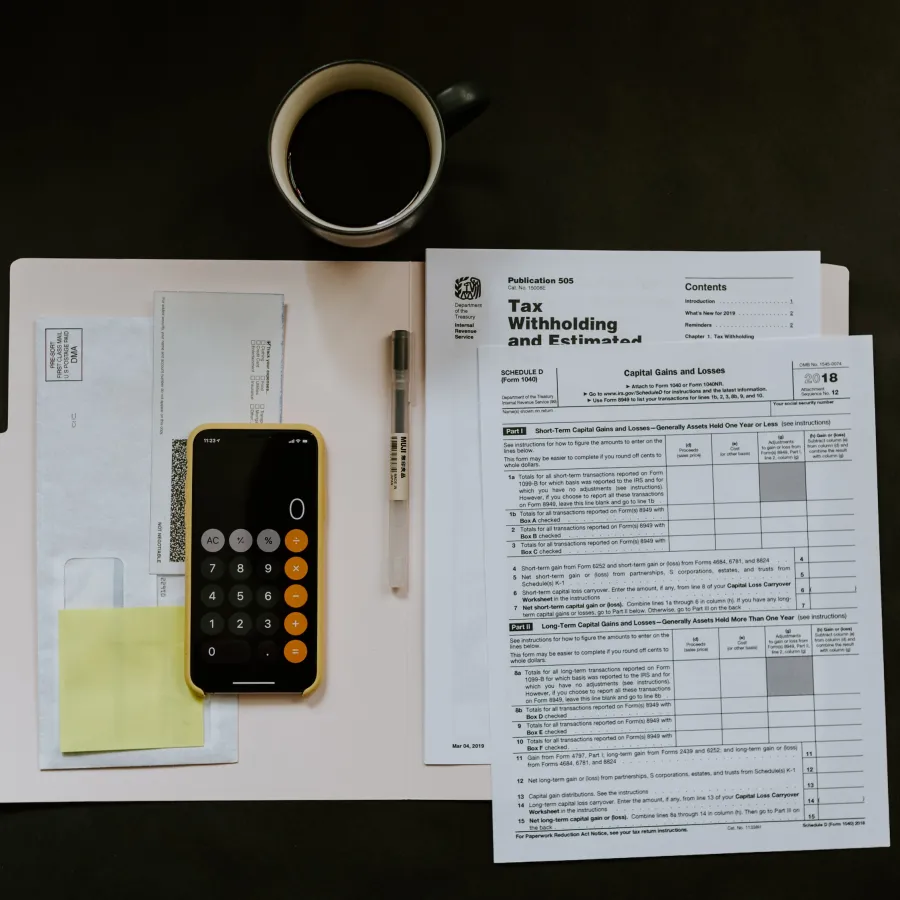 a cell phone and a pen on a piece of paper