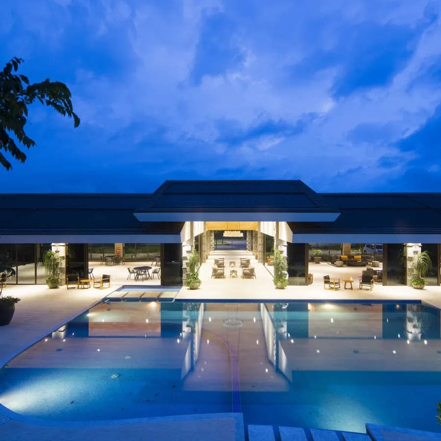 a swimming pool with a building in the background