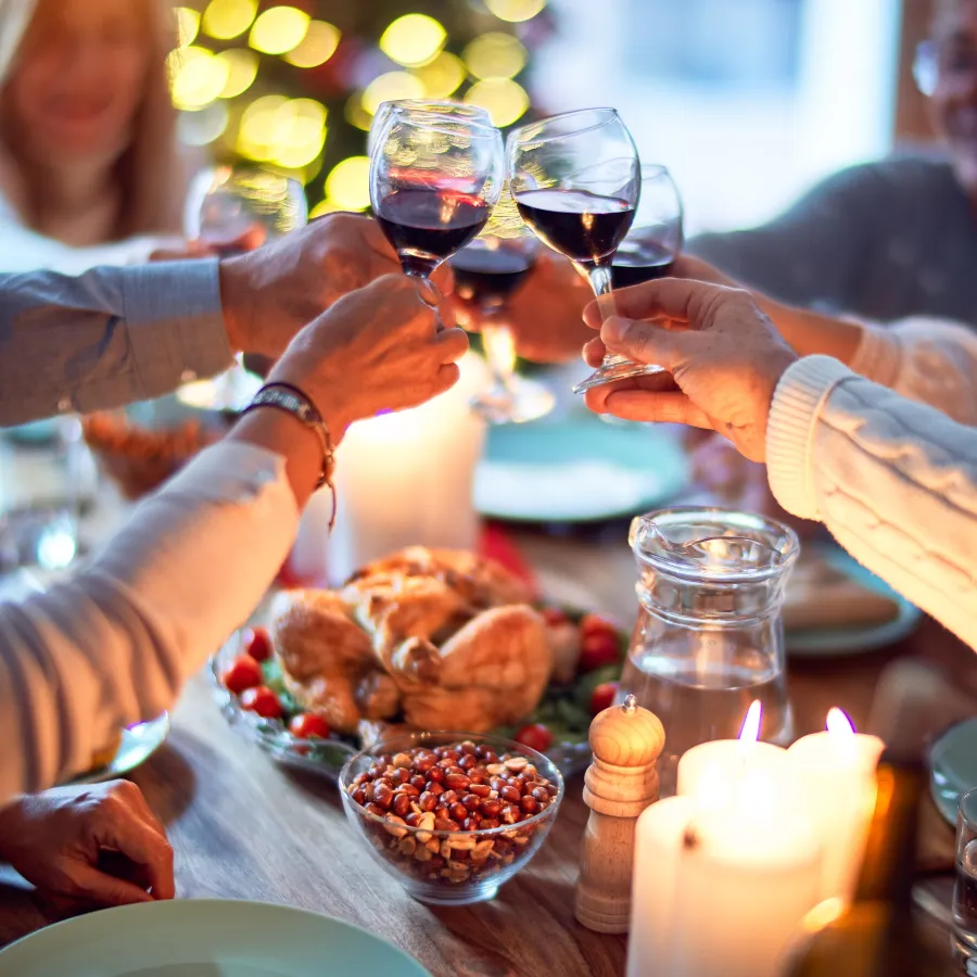 people holding wine glasses