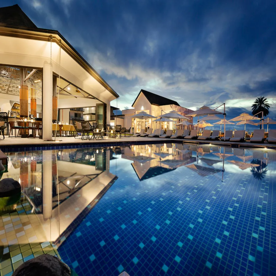 a pool with a building in the background