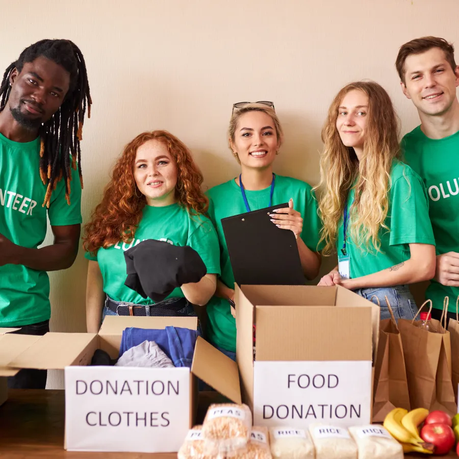 a group of people wearing green shirts