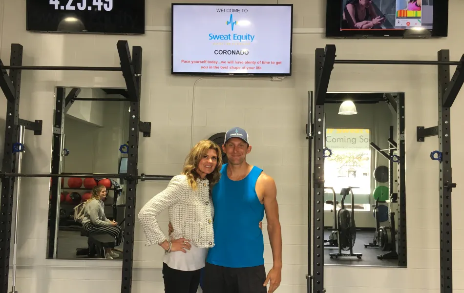 a man and a woman standing in front of a store