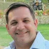 a man smiling for the camera