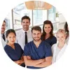 Smiling diverse medical team in scrubs and professional attire in bright modern healthcare setting