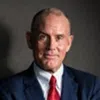 Ian Bannen wearing a suit and tie