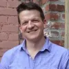 a man smiling for the camera
