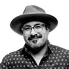 a man wearing a hat and glasses