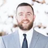 Kevin Bryce in a suit and tie