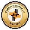 Gold emblem with text Proud Member of NATHO and an abstract design with orange and black figures.