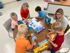 a group of children playing with toys
