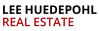 Red text spelling Real Estate on a transparent background in bold uppercase letters.