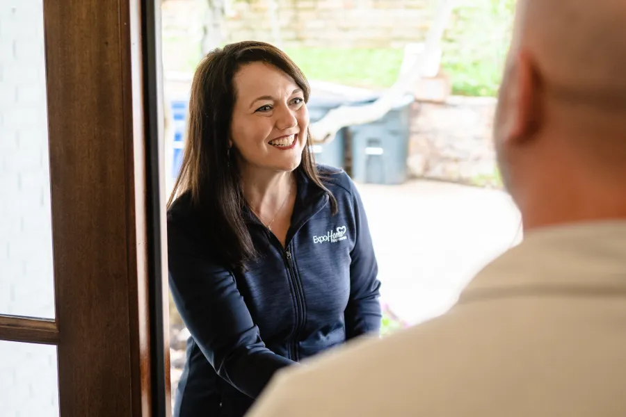 a woman smiling at a man