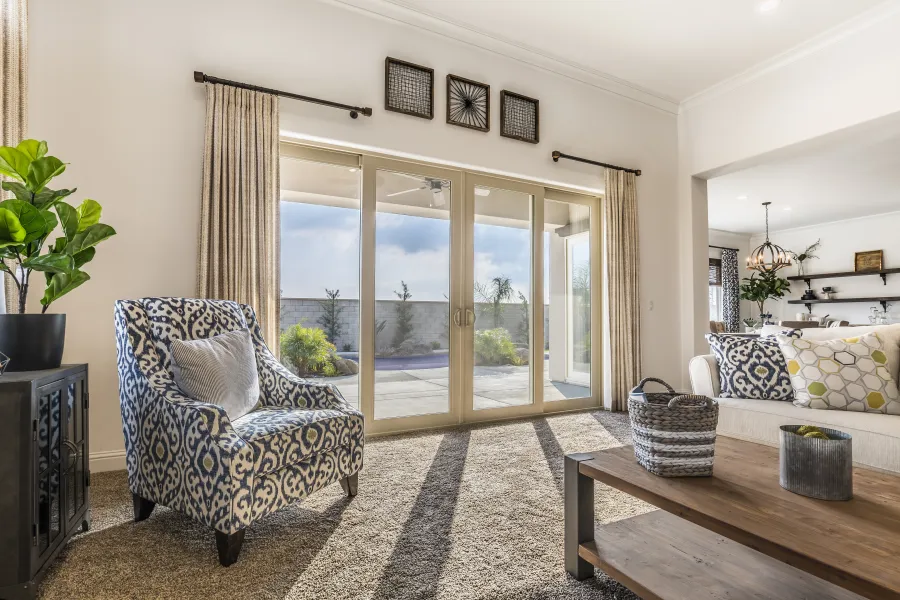 a living room with a large glass door