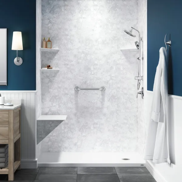 a shower with a towel on the wall