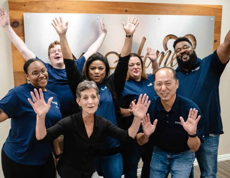 a group of people posing for a photo