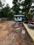 a small house with a trailer