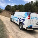 a white van on a dirt road