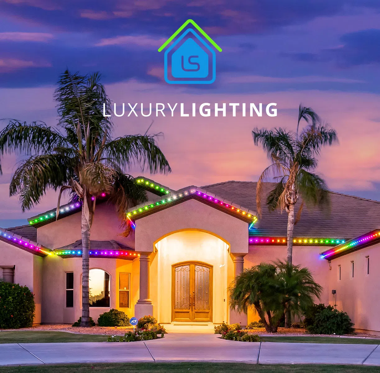 Luxury house with colorful LED roof lighting under a purple sunset sky with palm trees in the front yard